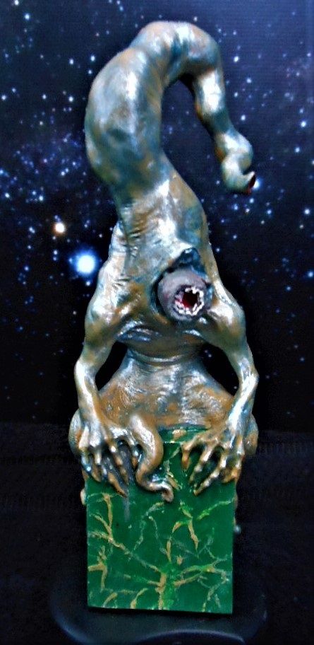 Another but vastly simpler version of Nyarlathotep I picked up on eBay. This resin casting came in one piece and stands a bit over six inches tall. The paint job is mine.