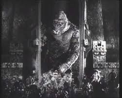 Screen shot of Kong breaking through the ineffective barrier posed by the wall and doors.